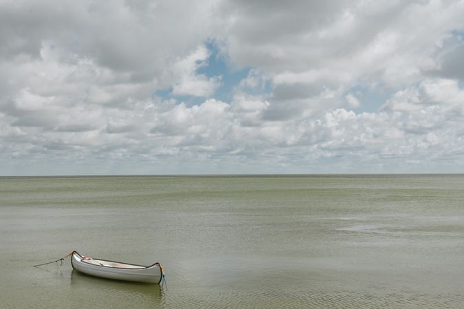 Seascape with fishing boat in silent water