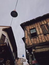 Looking up at old building on overcast day