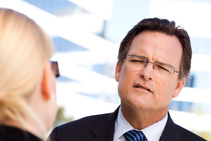Businessman Talking with Female Colleague