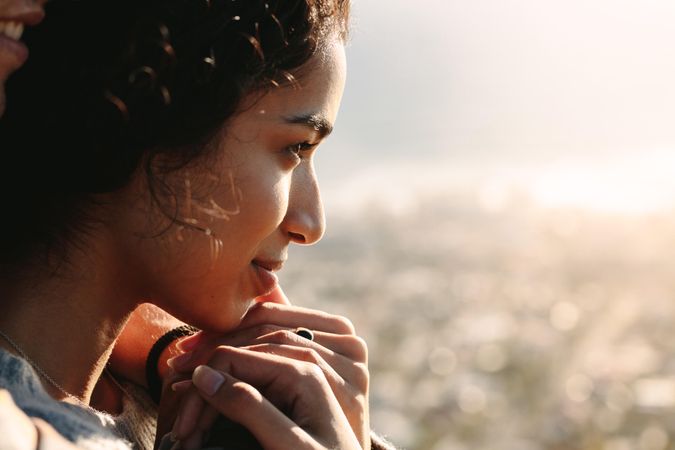 Close up of young woman face looking at a view outdoors