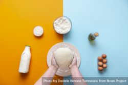 Baking flat lay with woman holding dough 4mDqd5