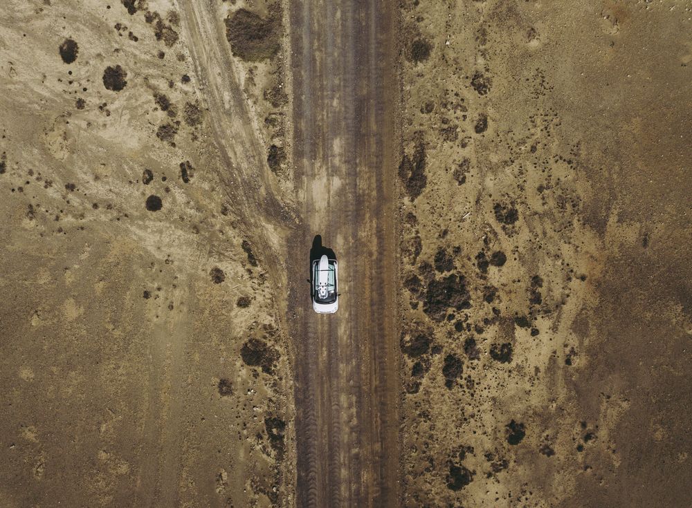 Car driving on road in picturesque desert