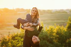 Happy mother and child at dusk together
