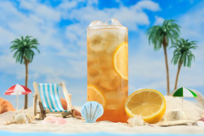 Iced Lemon tea on High Tall Glass in the Beach Miniature Holiday Concept