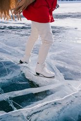 Woman skating on frozen river