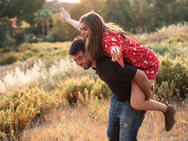 Happy couple having fun together in park