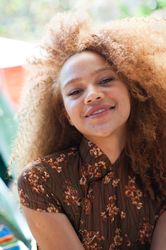 Close up portrait of young woman smiling at camera