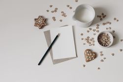 Christmas breakfast still life with crispy honey oat or buckwheat heart shaped cereals on table background