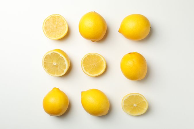 Flat lay with lemons on light background. Fresh fruit
