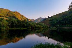Wonderful lake between forest and hills