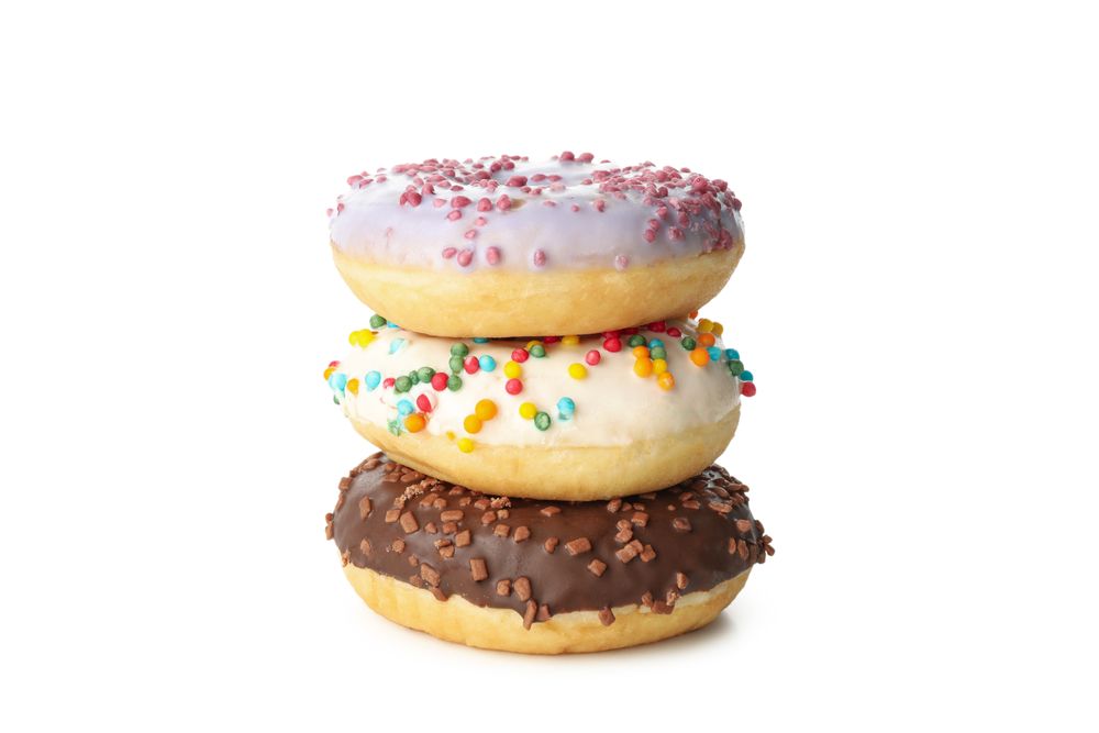 Tasty baked donuts isolated on plain background