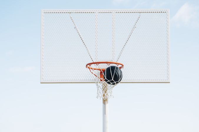 ball into basket in Outdoor basketball court and ball