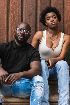 Black woman sitting with boyfriend