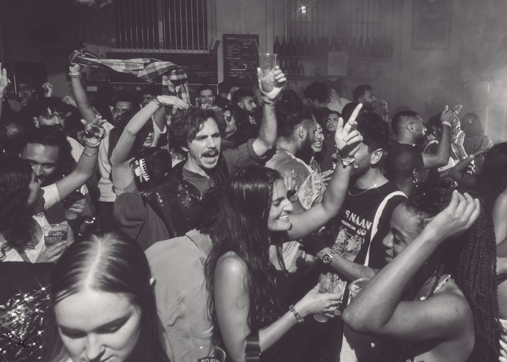 London, England, United Kingdom - Nov 9, 2022: B&W shot of people dancing at event