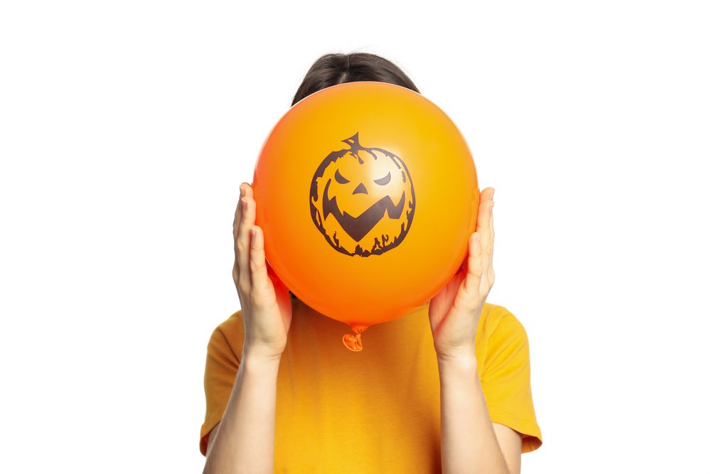 Woman hold halloween balloon, isolated on blank background