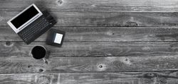 Tech vintage with coffee on old wood desk table