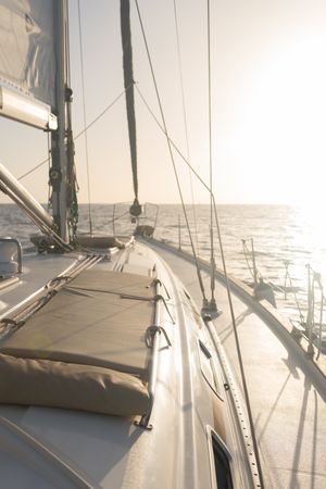Seats on nose of yacht on water