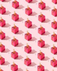 Close up of many red presents on pink background