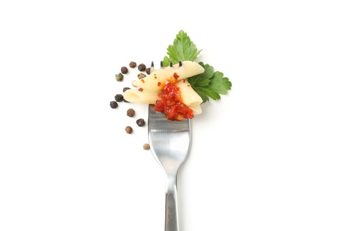 Fork with tasty pasta isolated on plain background