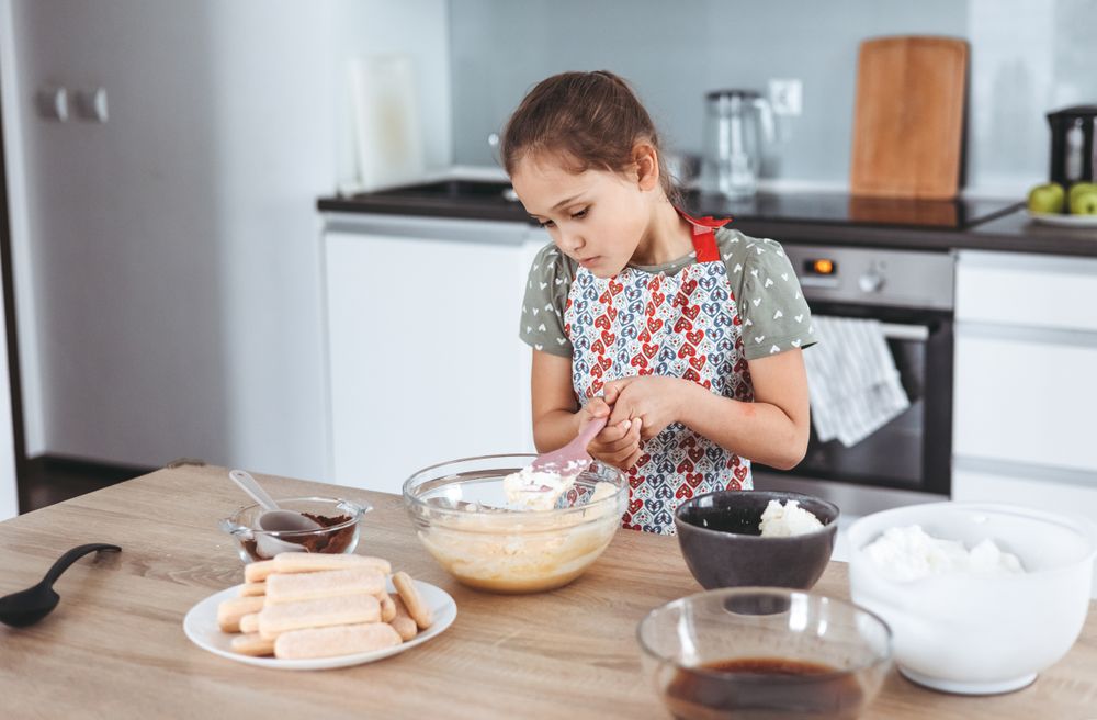 tiramisu making process in the kitchen