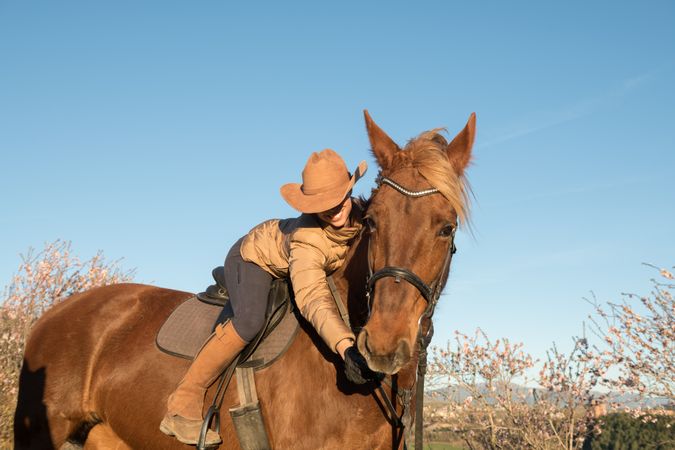 Woman on horse in field