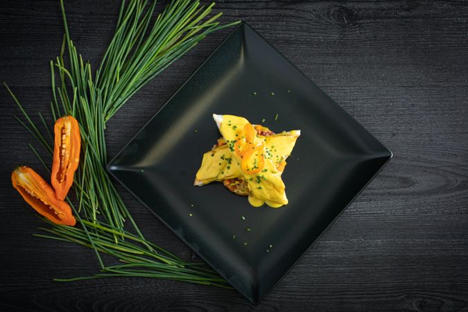 Corvina with yellow pepper sauce in plate