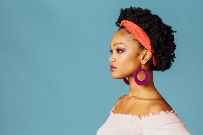 Studio shoot of thoughtful Black woman’s profile