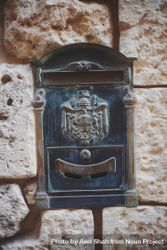 Post box embedded in wall with Coat of Arms bGYLe5