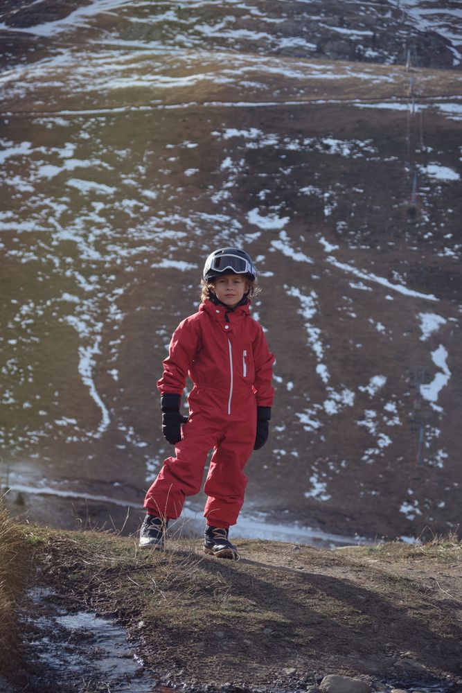 Boy looking at camera in spring in mountains