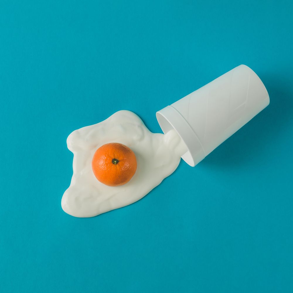 Orange and yogurt in fried egg shape