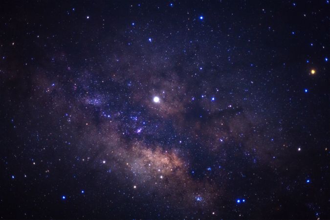 The center of the milky way galaxy with stars and space dust in the universe, Long exposure photograph, with grain