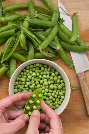 Peeling pea pods