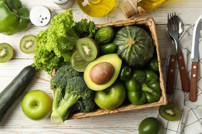 Concept of healthy food with vegetables and fruits on wooden table