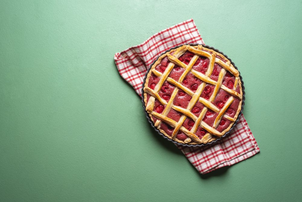 Raspberries cake with a lattice crust. Pie top view