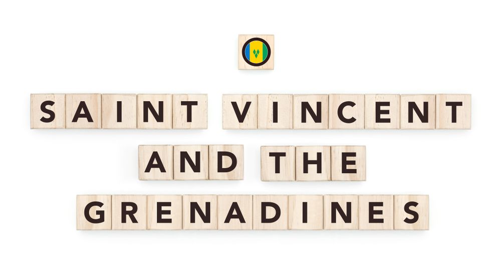 Wooden blocks bearing the name and flag of Saint Vincent and the Grenadines. Grenadinian and Caribbean Culture, national identity, travel, and geography in a copy space design.