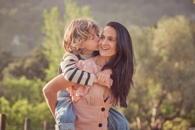 Happy mother with son in park