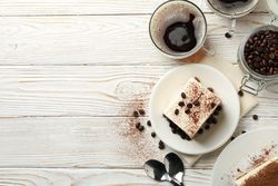 Composition with tasty tiramisu on wooden background. Delicious dessert
