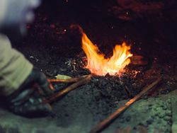 Crop farrier burning metal in furnace