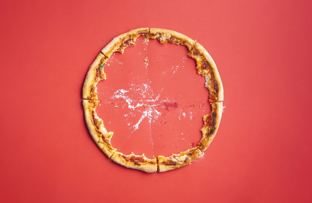 Pizza crust leftovers and crumbs