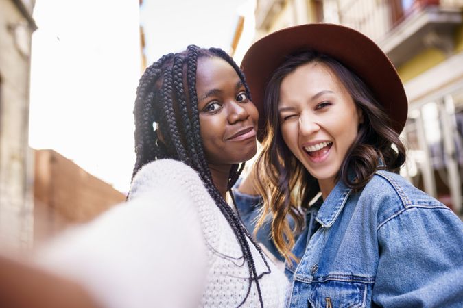 Female friends looking into the camera for a selfie