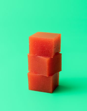 Marmalade cubes isolated on a green background
