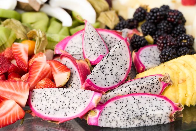 assorted fruits strawberries kiwi grape coconut coconut berries pumpkin dragonfruit