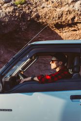 Male tourist in driver’s seat of van