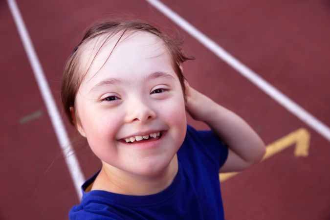 Close up of young child smiling at camera
