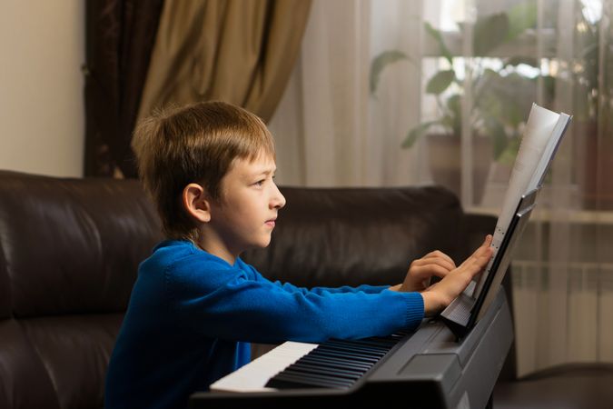 Boy's Piano Practice Session