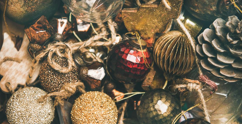 Rustic holiday tree decorations, pine cones, balls and baubles, wide composition