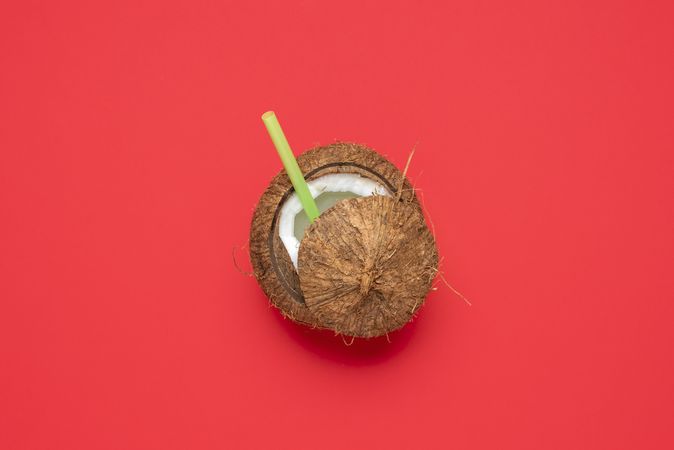 Coconut isolated on a red background