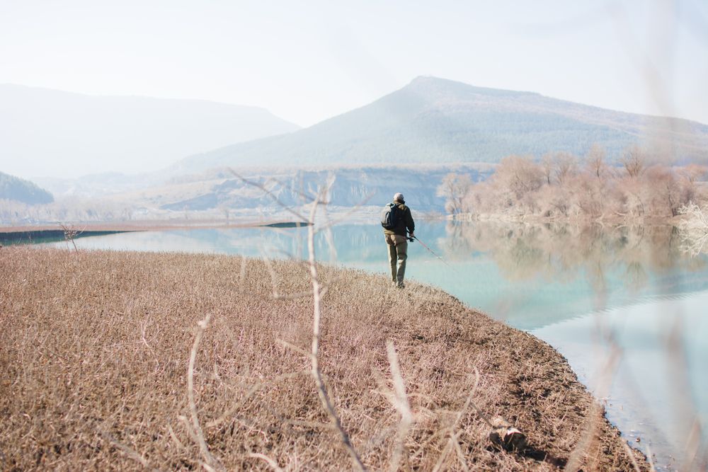 Man fishing near lake