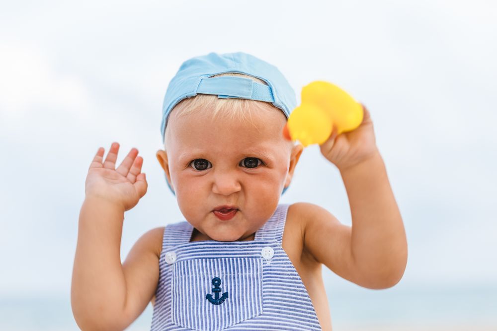 Baby boy playing with rubber ducks