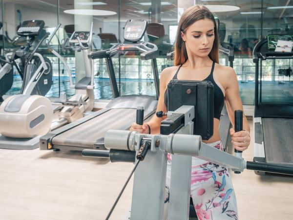 Strong female on row machine